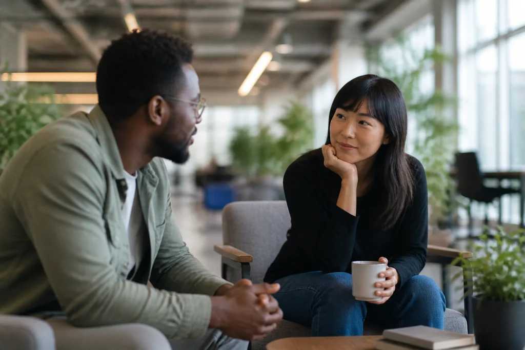A manager offering compassionate leadership and grief support during a conversation with an employee.